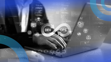 A developer works on a laptop with a DevOps logo