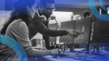 Two employees reviewing AI tool