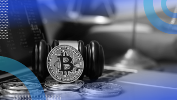 Bitcoin, gavel and a computer showing crypto trends
