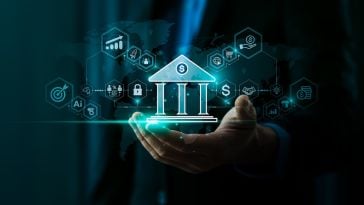 The image of a bank is held in someone's hand.