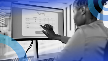 An employee completes a survey on a monitor