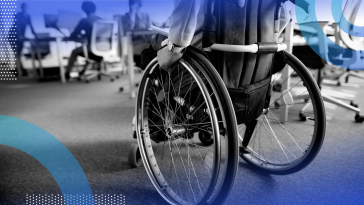 Person in a wheelchair entering an office