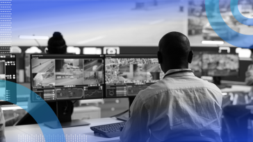 An AI-enhanced command center with workers on desktop screens