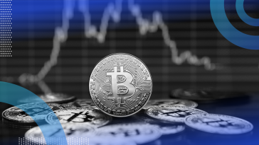 Crypto currency coin with stock market graph in background