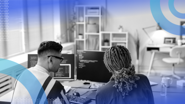 Two developers doing a coding interview evaluation