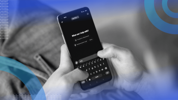 A closeup on a smartphone displaying the ChatGPT interface while someone uses it