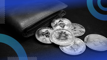 A wallet with crypto coins spilling out of it