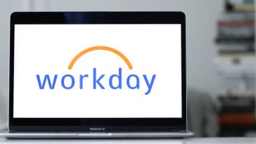 The Workday logo on the monitor of a laptop computer.