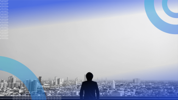 A person looks out from a balcony on a cityscape