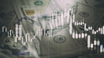 An image of money and analytics is shown.