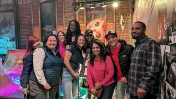 Zapier recruiting team members pose for a group photo during a team outing