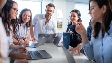 coworkers working around table