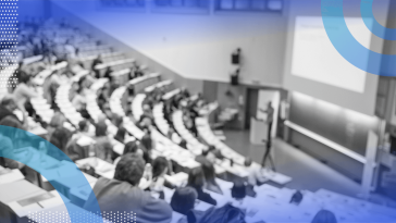 A professor gives a lecture in a lecture hall