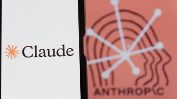 Image of smartphone screen with the Claude logo displayed, on top of a dark-orange background with the word "Anthropic" in black.