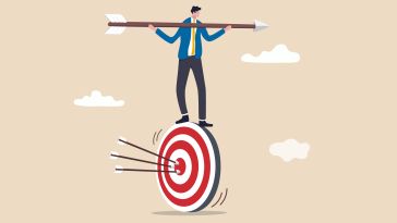 An illustration of a businessman balancing on a bulls-eye while holding a giant arrow, symbolizing the idea of being driven by a mission