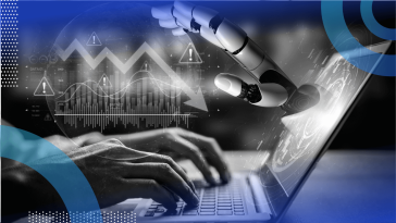 A robotic hand reaches out of a laptop screen as hands type on it with a downward economic trendline on top of it