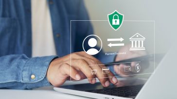 A person types on a laptop while a digital overlay displays icons for a secure bank transaction, a shield with a padlock, and the text "Payment Successful."
