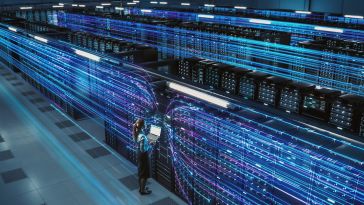 An illustration of glowing blue and purple lines layered across hardware inside a data center.