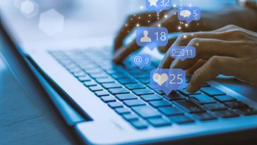 Hands typing on laptop 