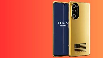 The golden Trump Mobile T1 phone is displayed standing up, overlayed on an orange background.
