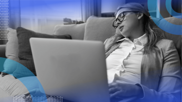 A woman sleeps with a laptop on her lap
