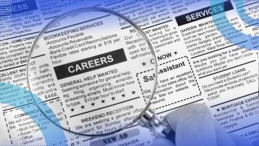 A magnifying glass over a newspaper classified ad