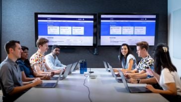 Built In employees meeting in a conference room