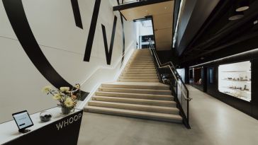 A staircase leading to a higher floor inside WHOOP’s Boston office