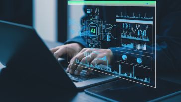 Hands typing on a computer with code overlaid
