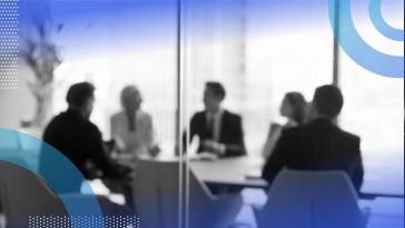 A group of businesspeople in a conference room