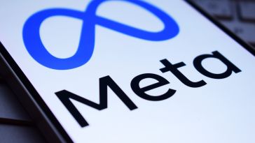 A close-up view of the Meta logo on a mobile phone screen.