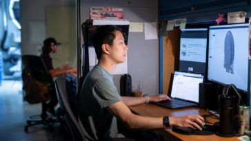 Bose employee working at computer