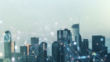 Los Angeles skyline with a digital network overlay of connected lines, glowing nodes and numbers representing big data technology.