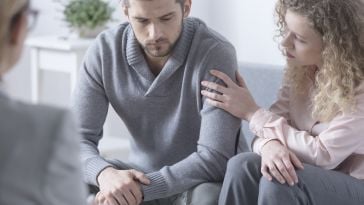 Bereaved couple shown.