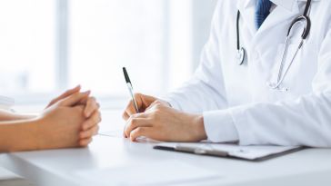 doctor conversing with patient