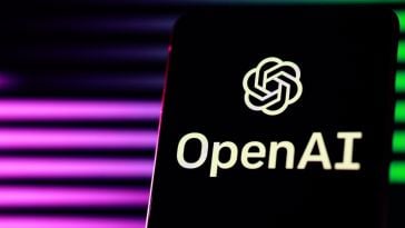A phone with the OpenAI logo displayed. The background is black with purple and green lights.