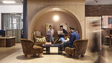 Genius AI employees collaborating in common areas in the NYC HQ.