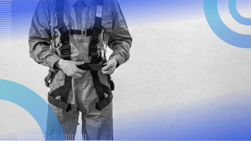 A worker wearing a safety harness