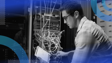 A network engineer works with a tablet