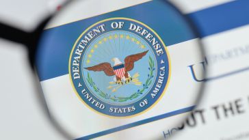 Image of button with Department of Defense logo.