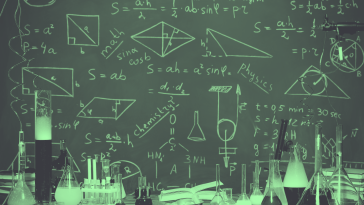 Lab equipment and a chalk board with equations