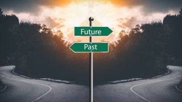 Sign post with "future" and "past." Interview prompt tell me about yourself