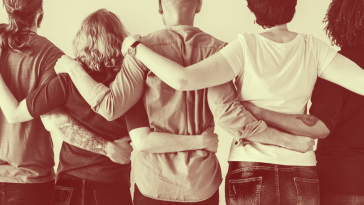 group of people embracing each other