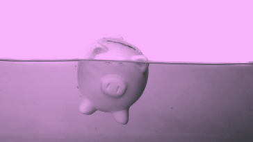 Piggy bank sinking in water.