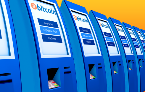 A row of Bitcoin ATMs extending infinitely into the distance.