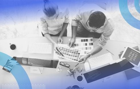 Colleagues working on design. Design skills can boost your resume and add value to your business.