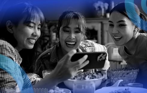 Three young people looking at videos.