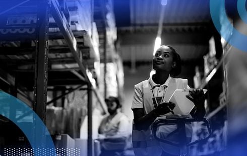 A warehouse worker carrying a clipboard.