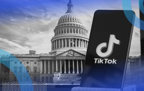 TikTok on a phone with the Capitol Building in the background.
