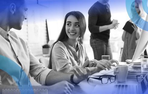 Employees working together in office